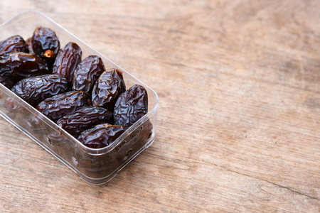 Dried dates are a high-energy fruit rich in beneficial nutrients and are commonly eaten during the Muslim fasting month of Ramadan. Copy space.の写真素材