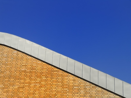 house wall with sky and roof edge