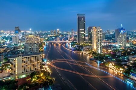Bangkok, Thailand - October 28, 2012: Blurred motion of running boats creates lines along Chao Phraya river.のeditorial素材