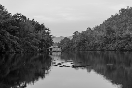 Floating raft house on the lake in the forest in black and white.の写真素材