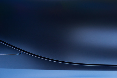 Abstract of blue car door with lines, light, reflection and shadow