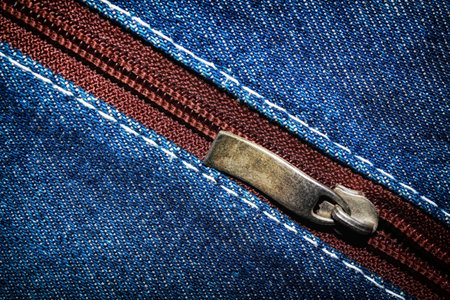 Blue denim jeans texture background with zipper,close up,select focus with shallow depth of fieldの写真素材