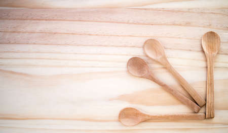 wooden spoon on wooden table background.の写真素材
