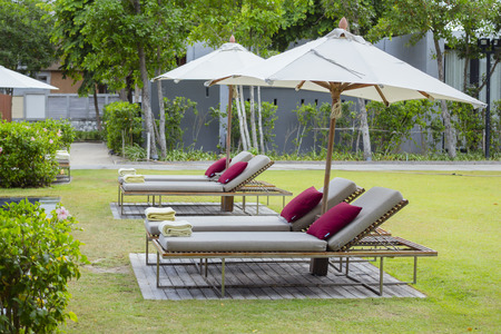 Relax Beach chairs and Umbrella at Swimming Pool Side.のeditorial素材