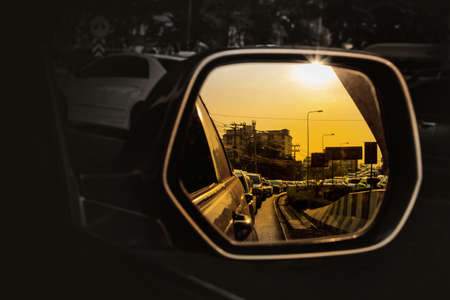Close-up of Automobile mirror. Reflection of traffic jam in Thailand.の写真素材