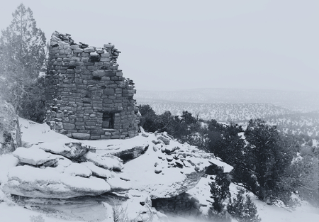 Painted Hand Tower, an Anasazi ruin, overlooking Hovenweep Canyon during a snow storm. A  black and white photograph of the Anasazi culture recorded in the style of the turn of the century explorers who first found these ancient ruins.の写真素材