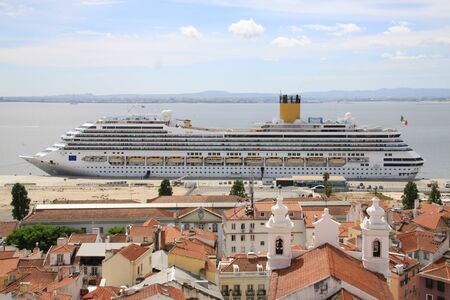 Cruise liner in front of the old town of Lisbonの写真素材