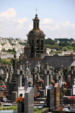 Cemetery with church in a small Breton townの写真素材