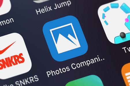 London, United Kingdom - September 29, 2018: Close-up shot of the Photos Companion application icon from Microsoft Corporation on an iPhone.のeditorial素材