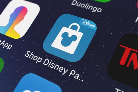 London, United Kingdom - October 03, 2018: Close-up of the Shop Disney Parks icon from Disney on an iPhone.のeditorial素材