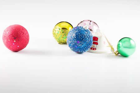 Christmas Balls red yellow green and white colours with white backgroundの写真素材