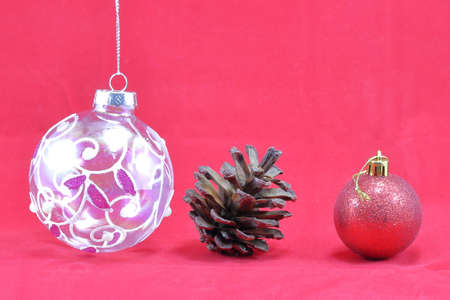 Christmas ornament decoration on red backgroundの写真素材