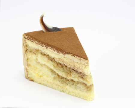 Cake slice chocolate tiramisu decorated fresh on white backgroundの写真素材