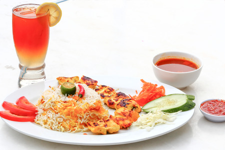 Shish Taouk set with Mandi Rice salad fresh lime sauce gravy and ice lemon tea