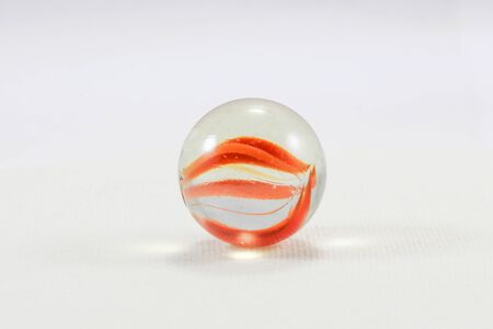 Glass marble colorful childhood play on white backgroundの写真素材