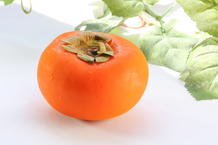 Persimmon Fruit sweet ripe juicy outdoor on white tableの写真素材