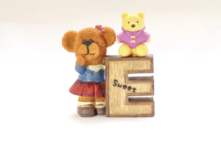 Clay Decoration Bear holding alphabet E small bear sittingの写真素材
