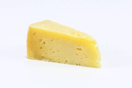 Cheddar Cheese Triangle cut slice on white backgroundの写真素材