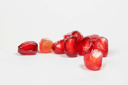 Pomegranate fruit seed red juicy healthy on white backgroundの写真素材
