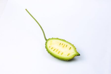 Spiny gourd green fruit vegetable kakrol on white backgroundの写真素材