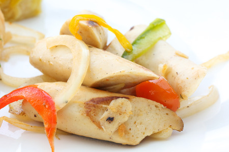 Stair fired chicken sausage with onion pepper tomatoの写真素材