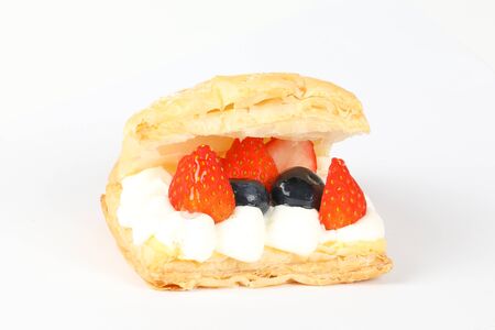 Fruity cream puff pastry on white background  の写真素材