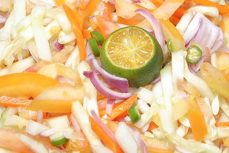 Mixed salad tomato cucumber lemon lime chili onion carrotの写真素材