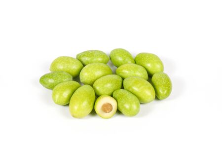 Green young olive on white background の写真素材
