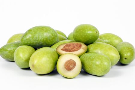 Green young olive on white background の写真素材