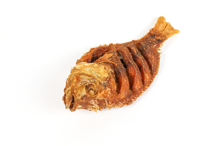 Deep fried tilapia fish whole crispy crunchy on white background 
の写真素材