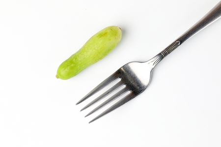 Small mini fresh green cucumber vegetable on white background の写真素材