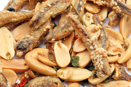 Peanut anchovy fry with spice mix sesame on white background の写真素材