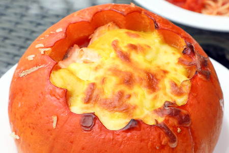 Seafood Risotto in Pumpkin Cheese topped on White Plate の写真素材