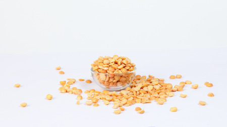 Yellow split chickpea peas boot chana dal lentil pulse bean on white background の写真素材