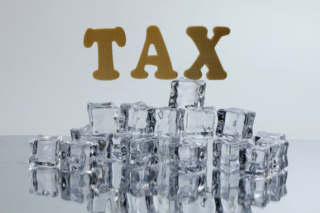 Tax alphabet ice cube freeze cool on white backgroundの写真素材