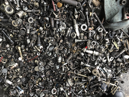 Metal Junk nuts bolts sparkplugs dusty dirty old trashの写真素材