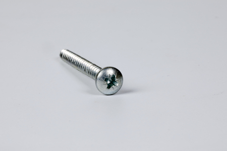 Metal screw plug on white background の写真素材