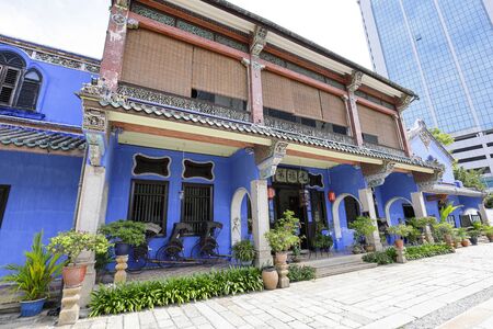 George Town, Penang, Malaysia â June 5, 2019: Cheong Fatt Tze, The Blue mansion was built at the end of 19th century by Chinese merchant. pulled rickshaw at the entrance.のeditorial素材
