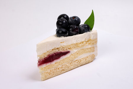 Blueberry cheese cake red berry jam stuffing on white backgroundの写真素材