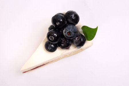 Blueberry cheese cake red berry jam stuffing on white backgroundの写真素材