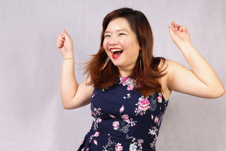 Young attractive southeast Asian woman posing facial expression happy joyfulの写真素材