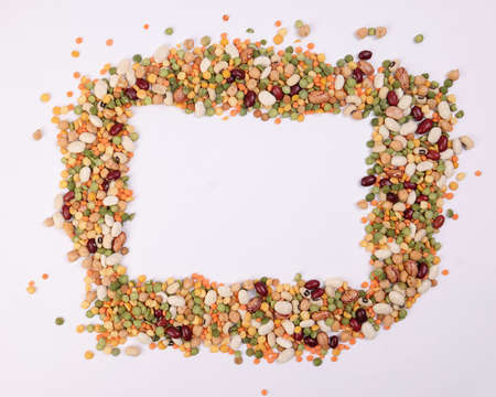 Mixed beans multi grain colorful mixture frame border copy text space on white backgroundの写真素材