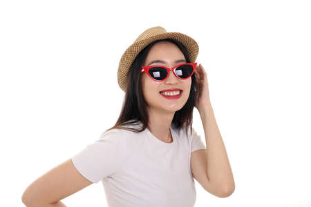Beautiful young south east Asian woman wearing red frame sunglass eyewear hat pose fashion style...