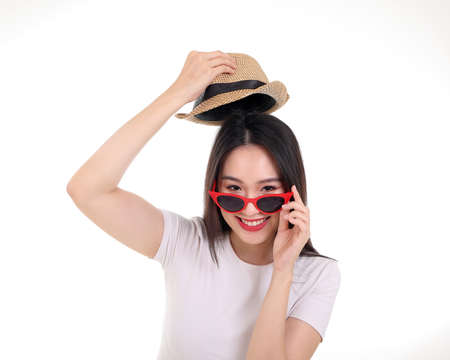 Beautiful young south east Asian woman wearing red frame sunglass eyewear hat pose fashion style...