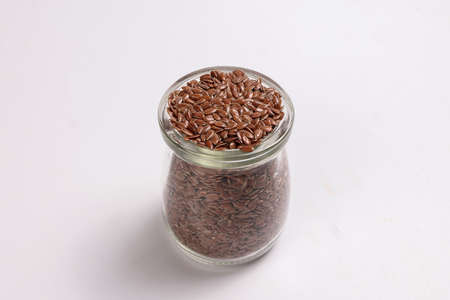 Flex seed flaxseed closeup in small glass jar bottleの写真素材
