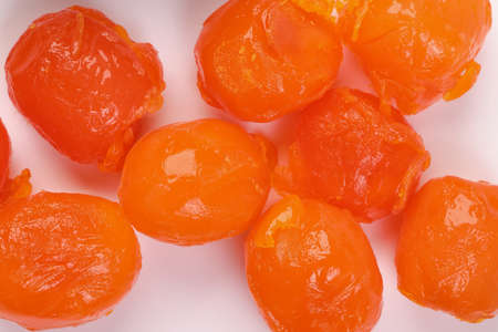 Round orange salted egg yolk cuisine cake ingredient on white background closeup macro