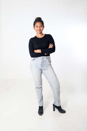 Young attractive Asian Indian woman pose face body expression mode emotion on white background stand...