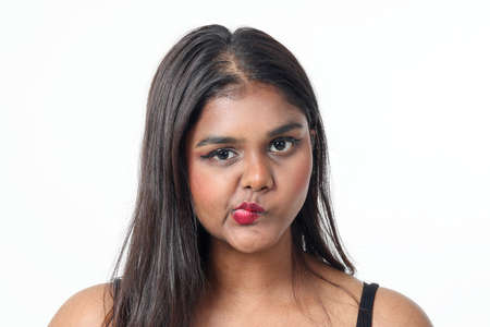 Young attractive Asian Indian woman pose face body expression mode emotion on white background lips...