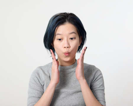 Young attractive Asian chinese malay woman pose face body expression mode emotion on white...