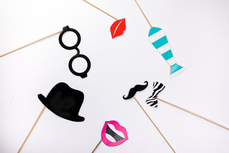 Black round eyewear spectacle frame hat moustache blue neck tie red crown lip smile shape paper die cut selfie portrait party fun paper prop sticker stick on white backgroundの写真素材